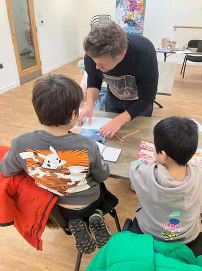 Engaged young comic artists